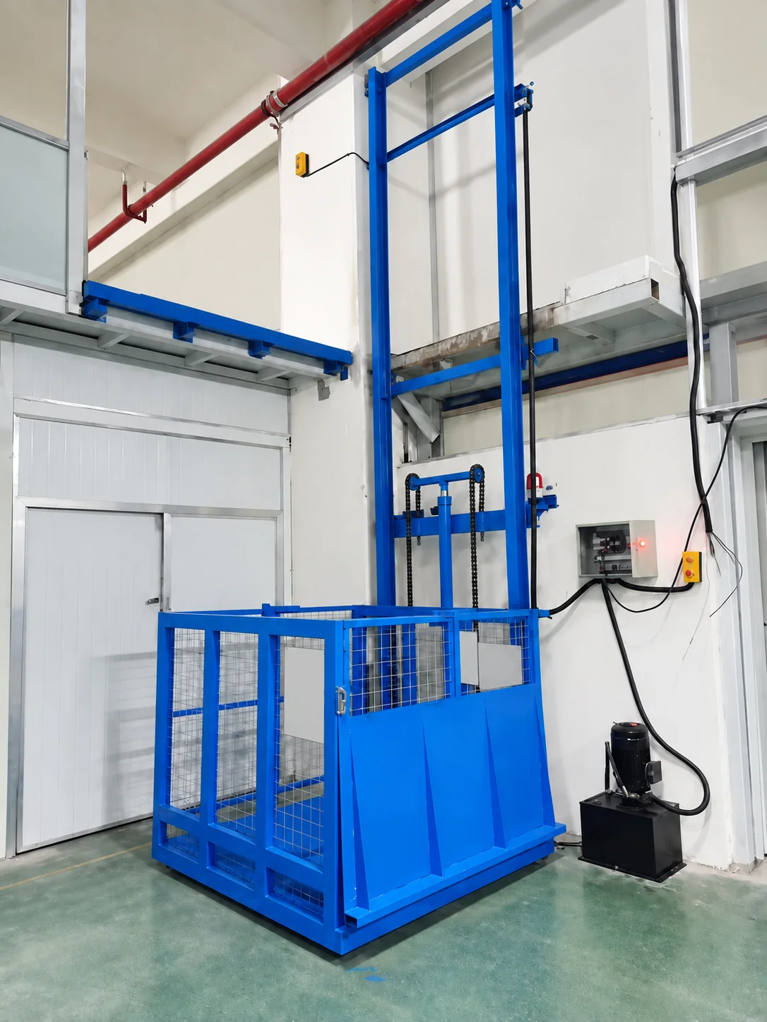 Blue single-sided cargo lift installation